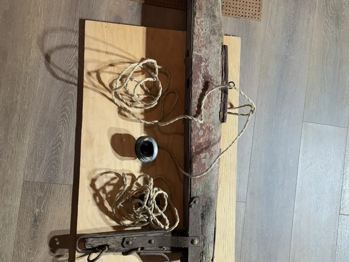 Custom bar light built from an antique horse-wagon frame - project photo